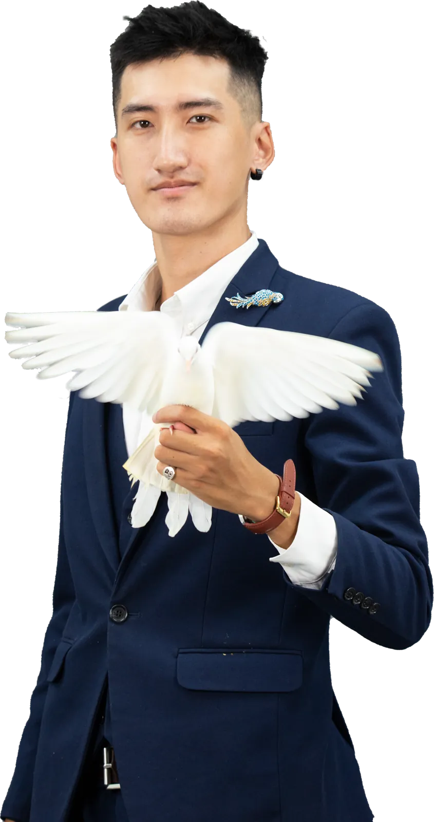Magician The Truong holding a white dove
